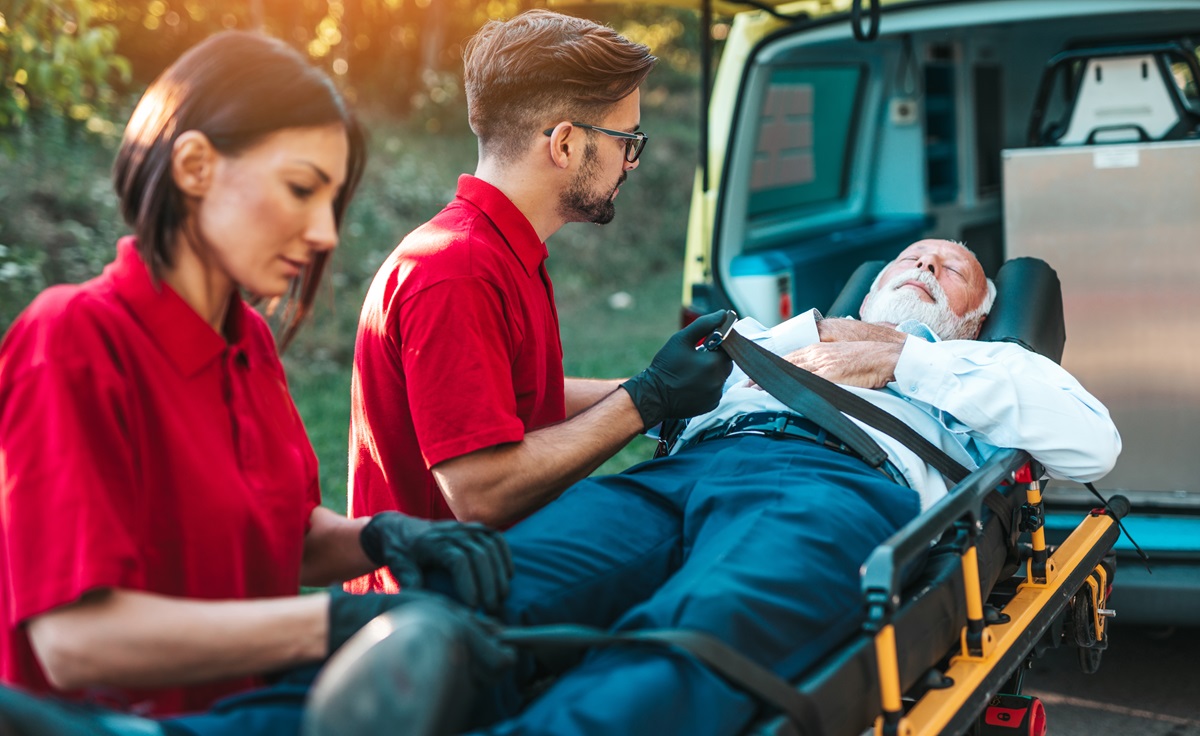 emergency-medical-service-work-paramedic-is-pulling-stretcher-with-senior-man-with-serious-heart-attack-ambulance-car-help-road-drivers-assistance-concept-2
