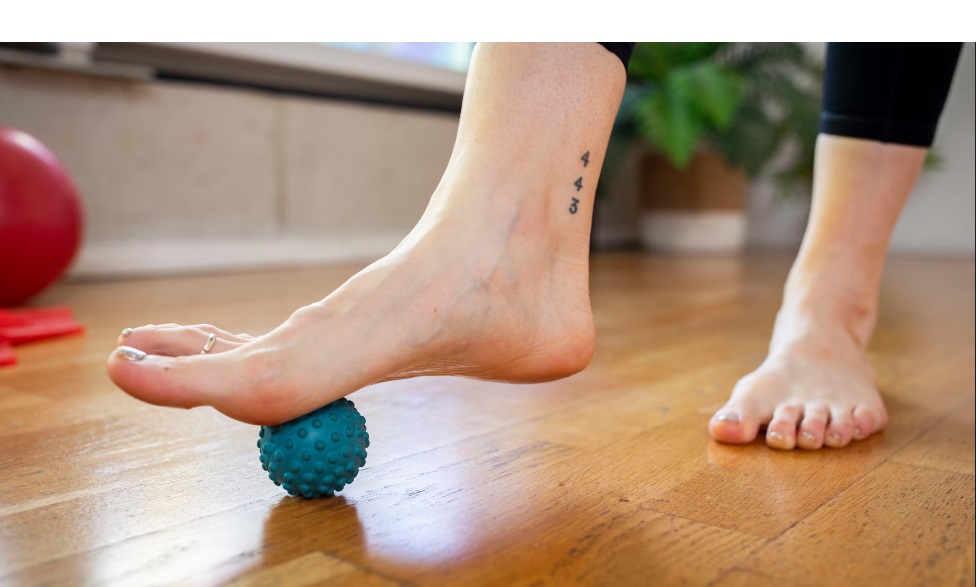 Roll with it … Eloise Skinner demonstrates how to use a massage ball on the bottom of your foot.